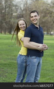 Portrait of love couple embracing outdoor