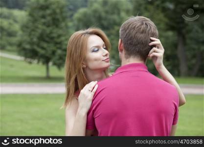 Portrait of love couple embracing outdoor