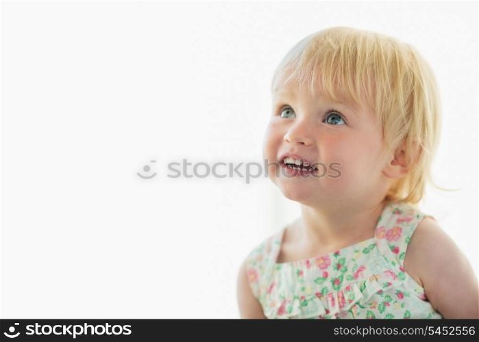 Portrait of lovely baby looking on copy space