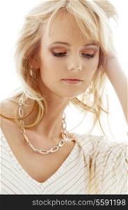 portrait of lovely blond with golden necklace