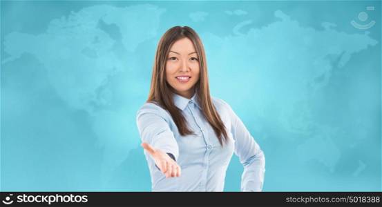 Portrait of lovely business woman offering handshake over world map on background