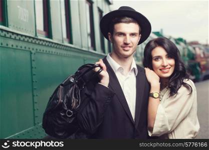 portrait of lovely couple on railway station