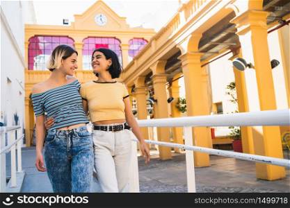 Portrait of lovely lesbian couple spending time together and having a date outdoors. LGBT., love and relationship concept.