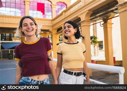 Portrait of lovely lesbian couple spending time together and having a date outdoors. LGBT., love and relationship concept.