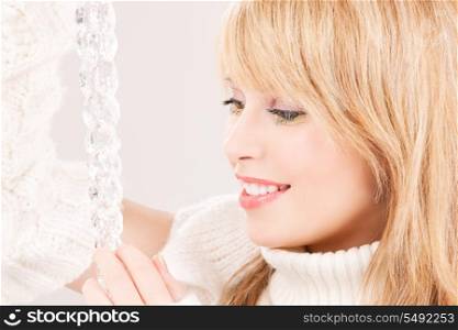 portrait of lovely teenage girl with icicle