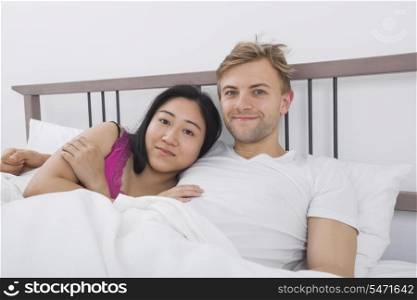 Portrait of loving couple in bed