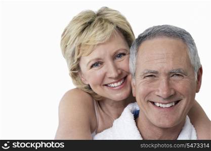 Portrait of loving couple smiling over white background