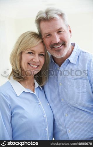 Portrait Of Loving Mature Couple At Home