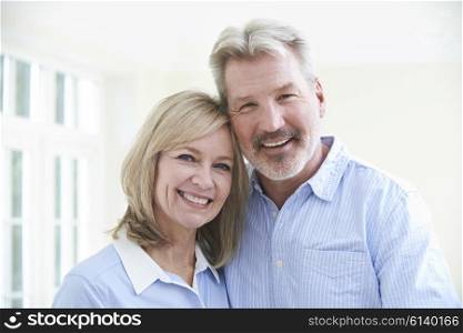 Portrait Of Loving Mature Couple At Home