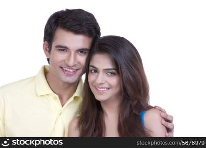 Portrait of loving young couple over white background