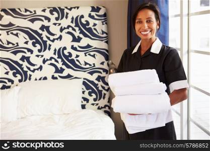 Portrait Of Maid Tidying Hotel Room