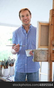 Portrait Of Male Artist Painting In Studio