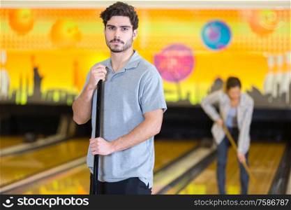 portrait of male cleaner at bowling alley