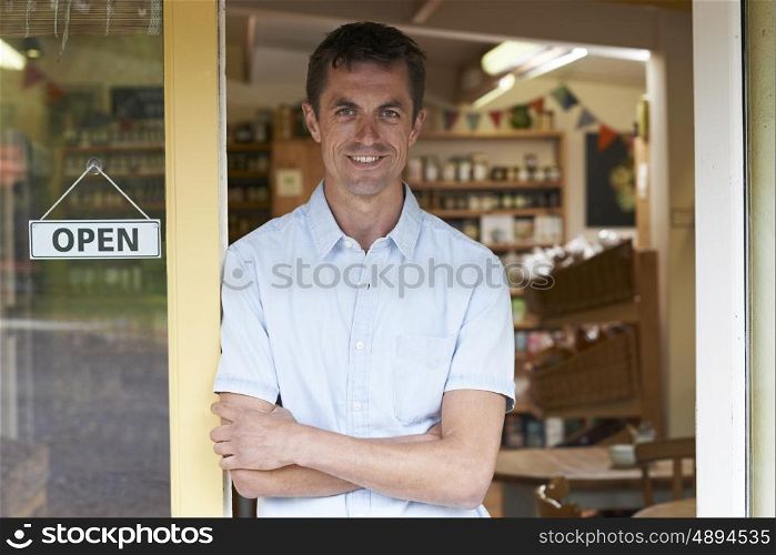 Portrait Of Male Delicatessen Owner Outside Store
