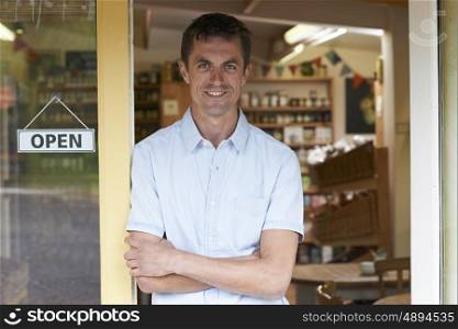 Portrait Of Male Delicatessen Owner Outside Store
