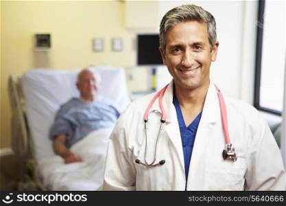 Portrait Of Male Doctor With Patient In Background