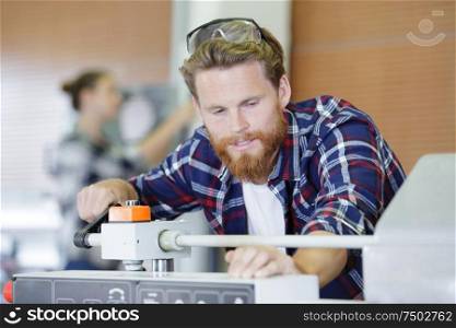 portrait of male engineer in factory