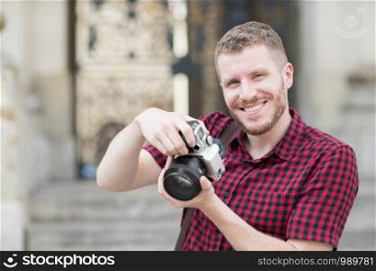 Portrait Of Male Photographer Working In Street