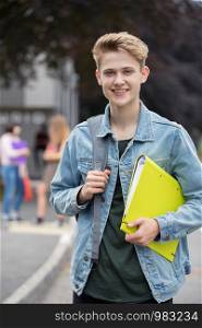 Portrait Of Male Teenage Student Outside School Building