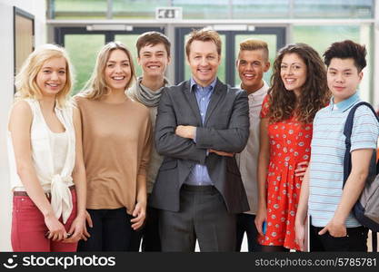 Portrait Of Male Tutor In Class With Students