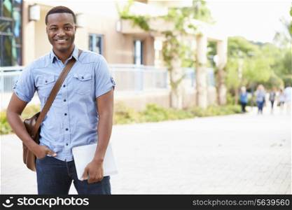 Portrait Of Male University Student Outdoors On Campus