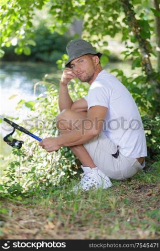 portrait of man fishing alone