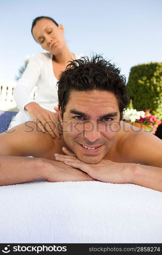 Portrait of man having massage