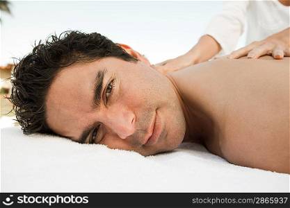 Portrait of man having massage