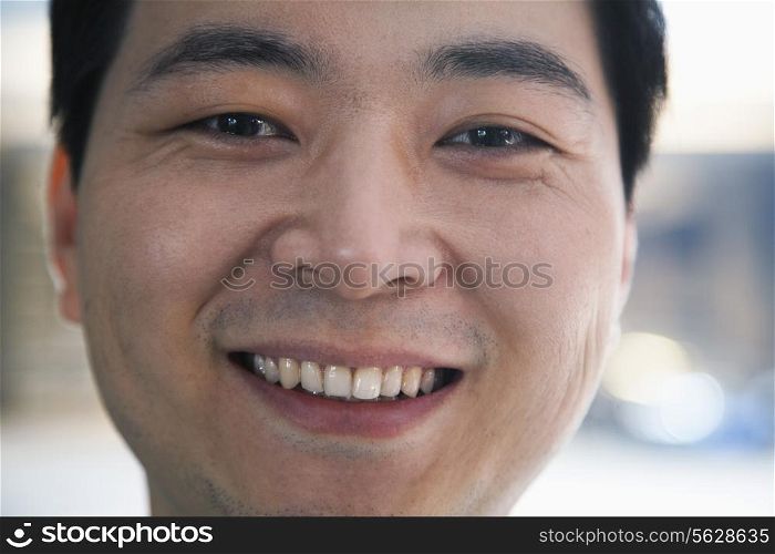 Portrait of man in a parking garage, close-up, Beijing