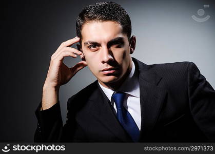 Portrait of man in dark studio