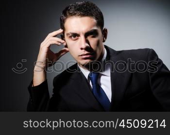 Portrait of man in dark studio