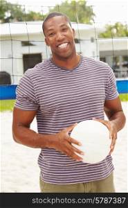 Portrait Of Man In Garden With Volleyball