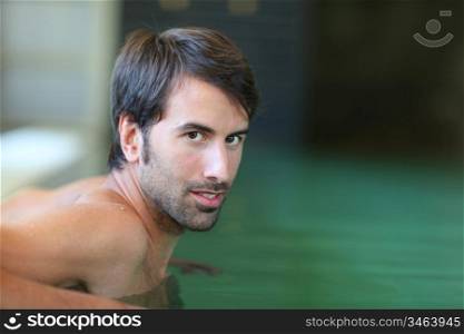 Portrait of man in spa pool
