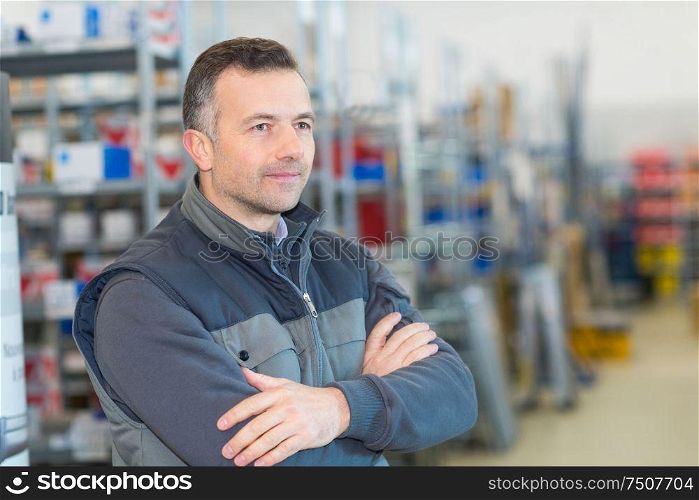 portrait of man in stores wearing gilet