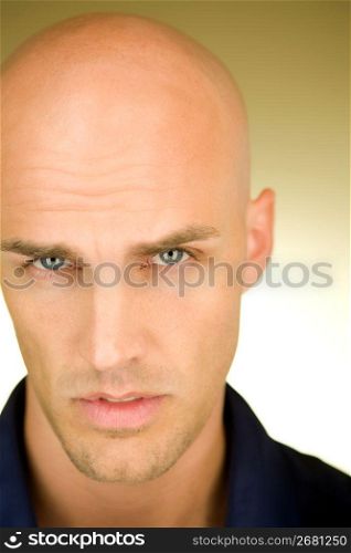 Portrait of man looking at camera with expression of doubtfulness