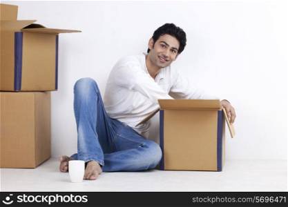 Portrait of man moving into new home