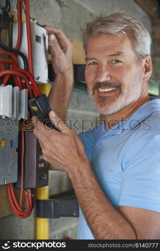 Portrait Of Man Taking Electricity Meter Reading