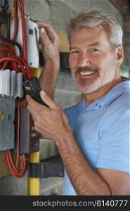 Portrait Of Man Taking Electricity Meter Reading