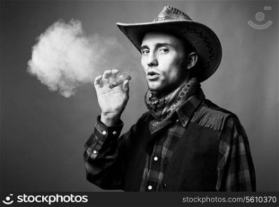 Portrait of man. The man smokes a cigar. Black and white photo