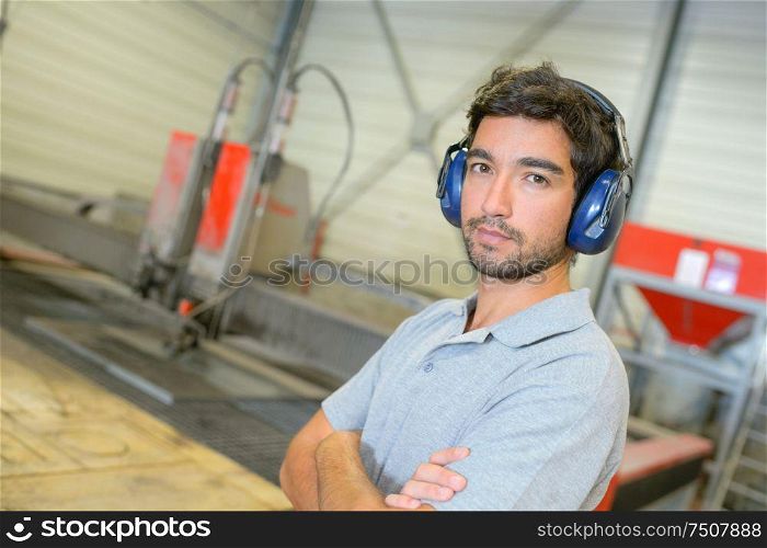 Portrait of man wearing earmuffs