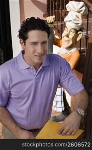 Portrait of man wearing purple shirt