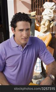 Portrait of man wearing purple shirt