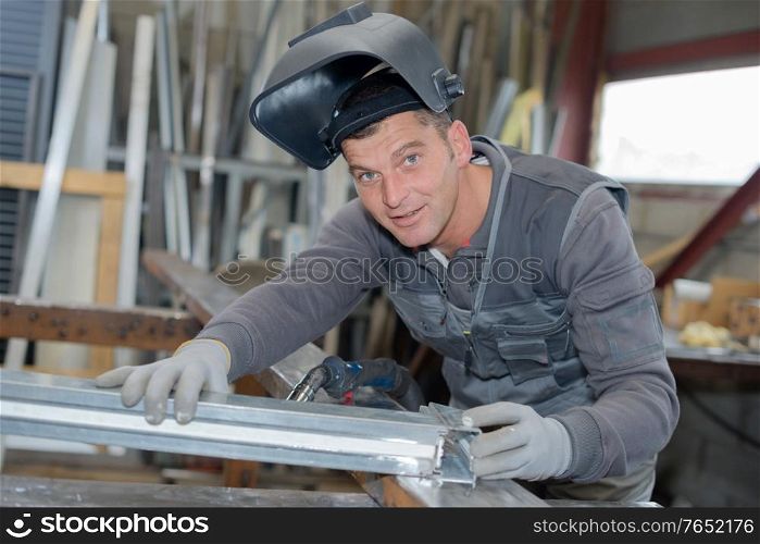 Portrait of man wearing welding helmet