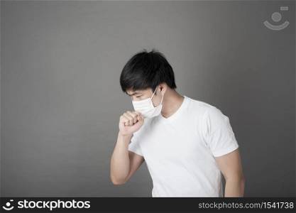 Portrait of Man with surgical mask in studio, Health care concept