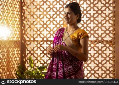 Portrait of married Gujrati woman looking outside