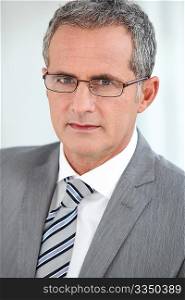 Portrait of mature businessman with eyeglasses