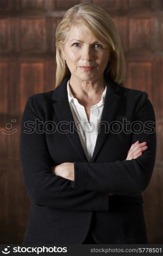Portrait Of Mature Businesswoman In Boardroom