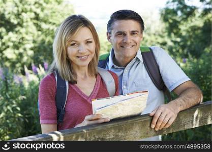 Portrait Of Mature Couple Hiking In Countryside
