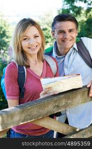 Portrait Of Mature Couple Hiking In Countryside