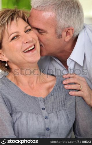 Portrait of mature couple laughing